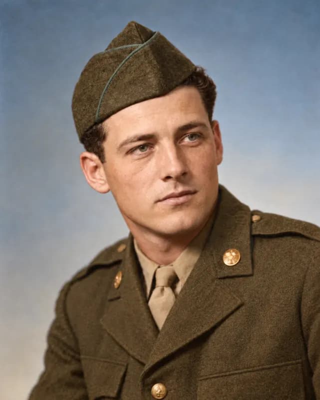 Restored 1940s portrait of a young soldier in uniform, scratches removed